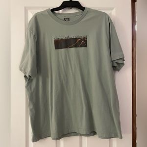 Green t-shirt with mountain design